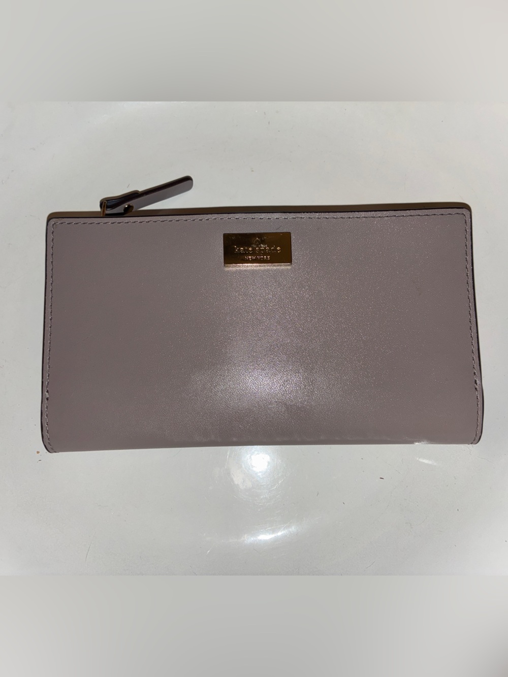 Kate Spade soft gray leather bifold wallet